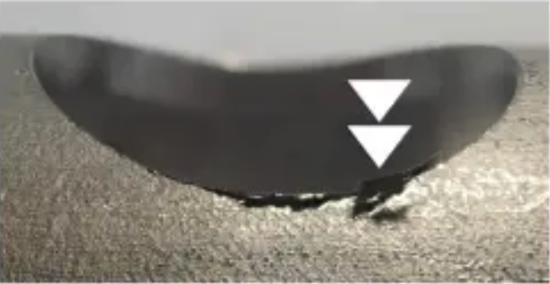 A workpiece shows burrs left behind by deburring tool